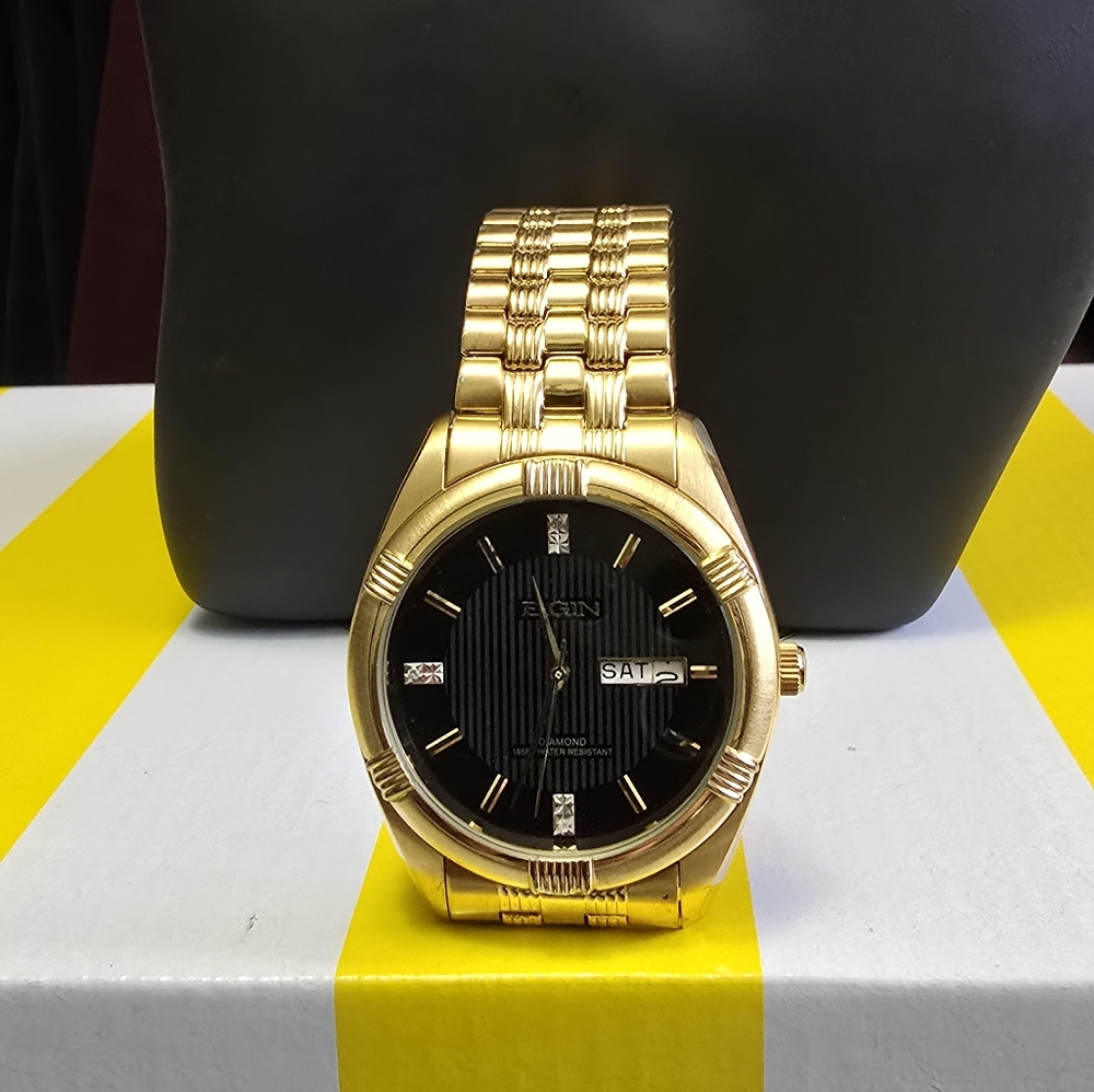 Elgin Gold and Black Watch with Day Display